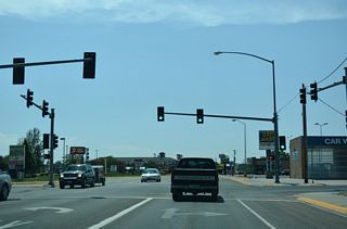 Haynes Avenue expands into a commercial boulevard south ahead of the traffic light at Stower Street.