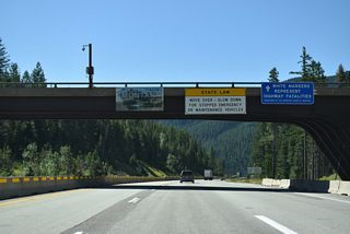 The Montana welcome sign appears within the folded diamond interchange (Exit 0) at Lookout Pass near Taft.