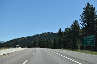 Highway 10 (CR 8) continues south from Remount Road by Cayuse Hill to the diamond interchange at Exit 82. Big Horn Road ties into the exchange from the south.