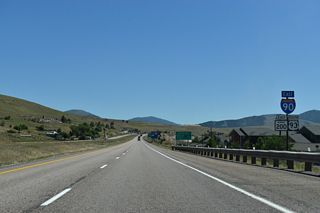 I-90/U.S. 93-MT 200 continue east from Airway Boulevard by the Canon Creek Village development.