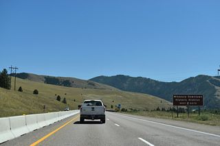 Orange Street intersects Broadway Street (Business Loop I-90) a half mile south of Exit 104 and doubles as U.S. 93 Business to Stephens Avenue.