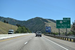 I-90/MT 200 pass north of the Missoula city center ahead of the dumbbell interchange (Exit 105) with U.S. 12 (Van Buren Street) west to the University of Montana campus.