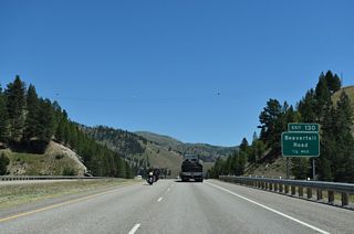 Beavertail Road south and Bonita Station Road north come together at a diamond interchange (Exit 130) with I-90/U.S. 12 next to Beavertail Hill State Park.