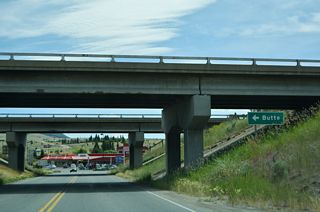 S-276 (Browns Gulch Road) south meets I-15/90 at Rocker in the consolidated city-county of Butte.