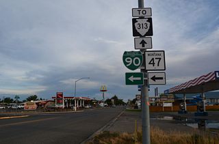 Crawford Avenue and Mitchell Avenue south to S-313 and Old Highway 87 is the former alignment of Montana Highway 47.