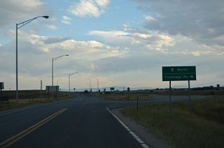 Old U.S. 10 separates from Business Loop I-90 along S Frontage Road.