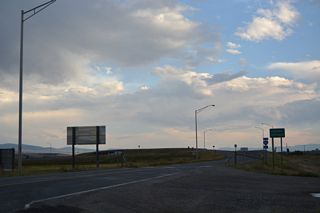 The end of Business Loop I-90 along Main Street defaults onto eastbound Interstate  90 beyond the intersection with S Frontage Road.