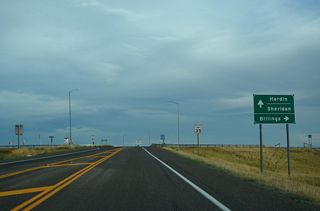 MT 47 runs south along the Hardin city line to the diamond interchange (Exit 495) along I-90/U.S. 87-212 where Business Loop I-90 east begins.