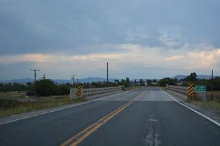 Business Loop I-90 (Main Street) proceeds north along Old U.S. 10 to cross the Clark Fork river.
