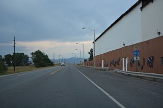 Interstate 90 trailblazer posted along Main Street north across from the Grant-Kohrs Ranch National Historic Site Visitor Center.