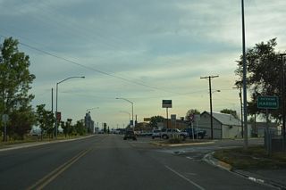 Business Loop I-90 (3rd Street E) angles southwest into the city of Hardin at 4th Street E. The 1960 USGS Hardin Quadrangle maps show 4th Street E as the old alignment of U.S. 87/212 across Hardin instead of 3rd Street E.