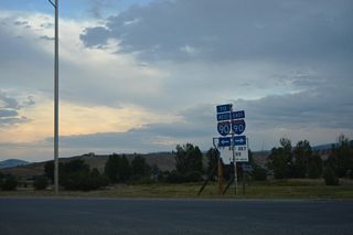 S Frontage Road (Old U.S. 10) ties into Business Loop I-90 (Main Street) just north of the exchange at Exit 187.