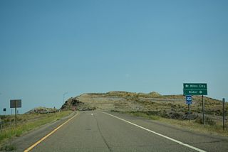 Business Loop I-94 lines Old U.S. 12 west 1.53 miles to Valley Drive (Old U.S. 10), which the route follows southwest back into Miles City.