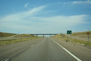 Moon Creek Road leads 28.63 miles south across ranch land.