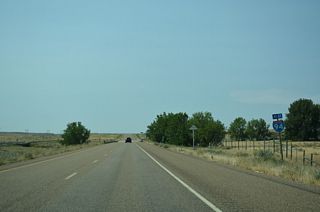 Westbound Interstate 94 crosses Cottonwood Creek beyond this confirming marker and mile marker 159.