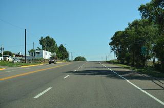 Business Loop I-94 reassurance marker posted east along Merrill Avenue at Cooke Street.