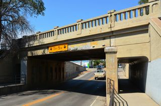 Main Street passes below the BNSF Railway west of Center Avenue and Valley Drive. The 53 foot long steel stringer bridge was built in 1932 (Baughn, 2021).