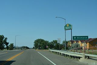 Merrill Avenue west at the eastbound entrance ramp for Interstate 94 to Bismarck, North Dakota.