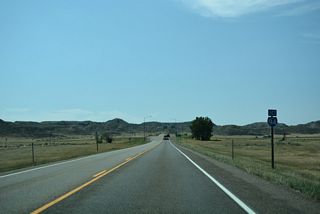 The historic alignment of U.S. 10/12 branches southwest from Business Loop I-94 ahead of the trumpet interchange (Exit 135) with Interstate 94 at the west end of the route.