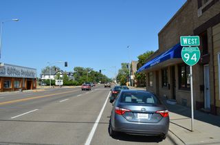 Business Loop I-94 west along Towne Street between Merrill Avenue and Kendrick Avenue at Downtown Glendive.