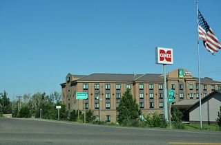 Business Loop I-94 commences southwest along Merrill Avenue from the diamond interchange along Interstate 94 at Exit 215.