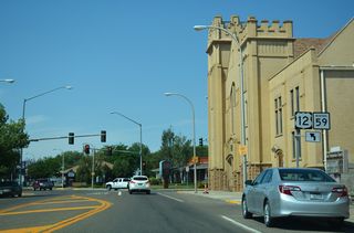 Shields for U.S. 12 remain posted along Business Loop I-94 west into Downtown Miles City. These trailblazers precede the southwestern turn of Main Street at Montana Avenue.