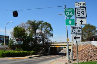 Business Loop I-94 and MT 59 overlap 0.43 miles west along Main Street into the Miles City center.