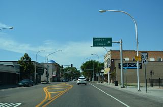 MT 59 branches north from Business Loop I-94 (Main Street) along 7th Street toward Miles City Airport (MLS).
