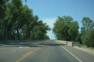 Business Loop I-94 (Main Street) runs between Riverside Park and Cook Lake ahead of the Tongue River.
