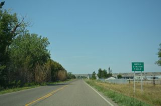 A weigh station precedes the southward turn of Business Loop I-94 onto Valley Drive.