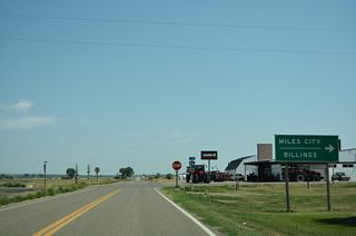 S-311 turns south from Pioneer Avenue (Old U.S. 10/312) onto Buford Street at th northeastern corner of Hysham. The guide sign referencing I-94 destinations was removed after 2021 due to construction of a business.