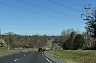 U.S. 29/74 lower east from Rustic Hills Circle to cross Abernethy Creek.
