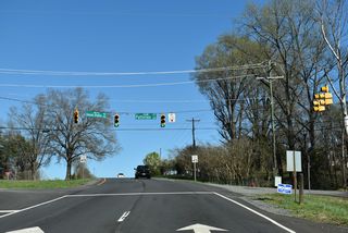 Shannon Bradley Road (SR 1135) arcs 1.60 miles northeast from U.S. 29/74 at Patterson Circle to NC 274 (Bessemer City Road).