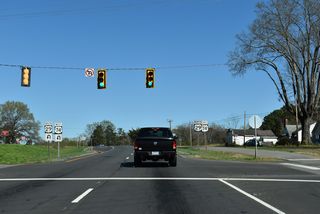 U.S. 29/74 continue east to Sparrow Springs Road (SR 1125) south. A frontage road, C.V. Alexander Drive (SR 1189) accompanies the south side of the four lane highway here.