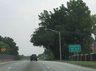 The ensuing exit for Market Street connects U.S. 29-70-220 (O&apos;Henry Boulevard) with NC A&T University. Market Street represents the former alignment of U.S. 70 west into Downtown from Bessemer.