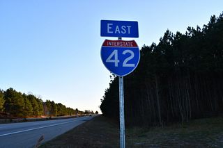 Ramps from I-40 to the Clayton Bypass converge just beyond the Johnston County line. The first confirming marker for Interstate 42 east follows.