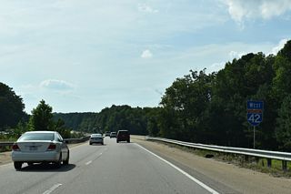 Interstate 42 (Clayton Bypass) crosses Austin Pond west of NC 36 / Veterans Parkway.