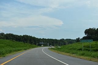 The ramp (Exit 1) to Interstate 40 east reenters Johnston County before joining the freeway mainline.