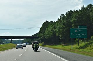 NC 42 formerly ran southwest from U.S. 70 Business in Clayton to U.S. 70 at what was Exit 320. The route north of Exit 4 along Veterans Parkway was decommissioned. 