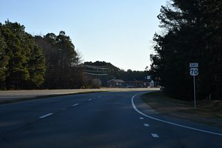 The intersection joining U.S. 70 with Braswell Road (SR 2519) south and Country Store Road (SR 2312) north uses J-turns with no cross traffic.