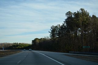 Ramps from I-40 to the Clayton Bypass converge at the Johnston County line.