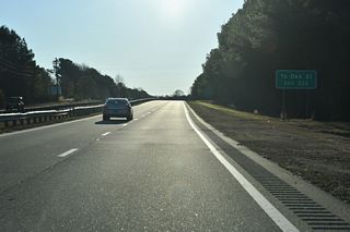The intersection with Oak Street (SR 1929) was converted to a right in right out (RIRO) from westbound U.S. 70 only by 2011. Oak Street connects with Buffalo Road (SR 1003) north of forthcoming Exit 333.