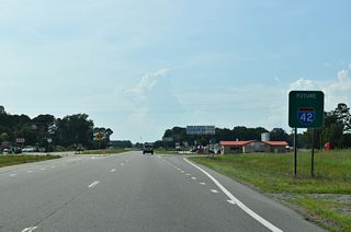 A Future I-42 corridor sign along U.S. 70 westbound precedes Old Cornwallis Road (SR 2371) north.