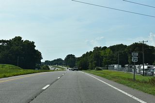 Whitley Church Road (SR 1232) stems 1.02 miles south from U.S. 70 to E Evans Road (SR 1231) beyond this shield assembly.