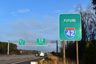 Construction through 2023 rebuilds the exchange at I-40 and the west end of Future I-42 with ramps for the Southeast Extension of the Triangle Expressway (NC 540).