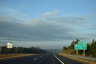 U.S. 70 meets Ranch Road (SR 1560) at a diamond interchange (Exit 323).
