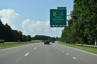 U.S. 70 separates with U.S. 70 Bypass at a wye interchange (Exit 336) in a half mile.