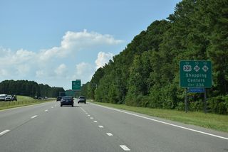 U.S. 70 shifts north onto an arterial from Exit 336 to U.S. 70A, I-95 and U.S. 301/NC 39-96 in Selma.