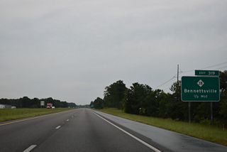 NC 38 extends 5.50 miles north from South Carolina Highway 38 to U.S. 74 Business (Hamlet Avenue) in the city of Hamlet.