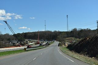 Section D of the Shelby Bypass replaces the bridges taking U.S. 74 across Buffalo Creek and adds a trumpet interchange just to the west with the new freeway.